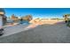 Relaxing pool area with large rock feature and spacious patio at 1964 Westwind Rd, Las Vegas, NV 89146