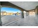 Covered patio overlooking a sparkling pool with a waterslide and spa at 1964 Westwind Rd, Las Vegas, NV 89146