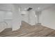 Upstairs hallway with vinyl plank flooring and access to bedrooms at 1964 Westwind Rd, Las Vegas, NV 89146