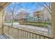 This covered balcony provides views of a common area with a walkway and mature trees at 26 E Serene Ave # 124, Las Vegas, NV 89123