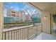 This balcony offers views of landscaped common area with mature landscaping and nearby buildings at 26 E Serene Ave # 124, Las Vegas, NV 89123