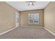 Comfortable bedroom with plush carpeting, ample natural light, and access to the outside at 26 E Serene Ave # 124, Las Vegas, NV 89123