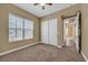 Bedroom with ceiling fan, carpet flooring, natural light, and closet access at 26 E Serene Ave # 124, Las Vegas, NV 89123