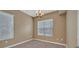 Bedroom with carpet, natural lighting, and a decorative chandelier at 26 E Serene Ave # 124, Las Vegas, NV 89123