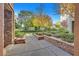 Landscaped courtyard with walkways and trees at 26 E Serene Ave # 124, Las Vegas, NV 89123