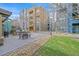 Exterior patio area includes a built-in grill, seating, and landscaped common areas at 26 E Serene Ave # 124, Las Vegas, NV 89123