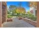 Exterior walkway with lush landscaping, stone accents, and walkways, enhancing the building's appeal at 26 E Serene Ave # 124, Las Vegas, NV 89123