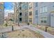 Building exterior showcases manicured landscaping, gravel, and walkways leading to various building entrances at 26 E Serene Ave # 124, Las Vegas, NV 89123