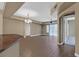 Open-concept living room and dining area with elegant lighting and beautiful tile floors at 26 E Serene Ave # 124, Las Vegas, NV 89123