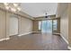 Spacious living room features stylish tile flooring and a sliding glass door to the outside at 26 E Serene Ave # 124, Las Vegas, NV 89123