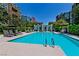 Stunning pool area surrounded by lounge chairs, landscaping, and stylish buildings at 26 E Serene Ave # 124, Las Vegas, NV 89123