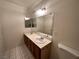 Bright bathroom with double sinks and a tiled floor at 3070 Tarpon Dr # 201, Las Vegas, NV 89120