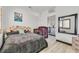 Bedroom with neutral walls and wood floors, complemented by a Las Vegas themed poster at 3738 Falcon Springs Dr, Las Vegas, NV 89147