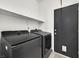 This laundry room is equipped with modern appliances and ample storage space at 3738 Falcon Springs Dr, Las Vegas, NV 89147