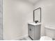 Modern bathroom with gray vanity and marble-tiled shower at 4450 Mountain Vista St, Las Vegas, NV 89121