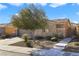 Single-story house with stone accents and mature tree in front at 4571 Plum Island Ct, Las Vegas, NV 89147