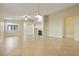 Bright and airy living room with tile floors and a fireplace at 4571 Plum Island Ct, Las Vegas, NV 89147