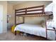 This bedroom features a wooden bunk bed with a bright yellow beanbag chair at 4625 Centisimo Dr # 202, North Las Vegas, NV 89084