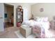 Well-lit bedroom featuring a bed, bookshelf, and ensuite bathroom access at 4625 Centisimo Dr # 202, North Las Vegas, NV 89084