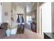 Hallway with a decorative console table, coat rack, and view to the main bedroom at 4625 Centisimo Dr # 202, North Las Vegas, NV 89084
