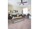 Bright living room with ceiling fan, with beach-themed decor creating a serene and inviting ambiance at 4625 Centisimo Dr # 202, North Las Vegas, NV 89084
