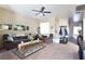 Cozy living room with a ceiling fan, neutral paint, and comfortable seating arrangement at 4625 Centisimo Dr # 202, North Las Vegas, NV 89084