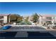 The community's parking lot is easily accessible and provides access to the sports court in the distance at 4625 Centisimo Dr # 202, North Las Vegas, NV 89084