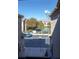View from the home's balcony highlighting the parking lot, sports court, and scenic mountain views at 4625 Centisimo Dr # 202, North Las Vegas, NV 89084