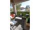Relaxing outdoor patio with comfortable seating, a grill, and decorative greenery for privacy at 4625 Centisimo Dr # 202, North Las Vegas, NV 89084