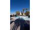Community pool surrounded by lounge chairs and lush landscaping, perfect for hot summer days at 4625 Centisimo Dr # 202, North Las Vegas, NV 89084