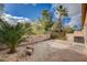 Private backyard showcasing pavers, stone accents, and lush green landscaping, creating an inviting outdoor oasis at 5201 Progresso St, Las Vegas, NV 89135