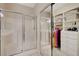 Bright bathroom featuring a glass shower and custom shelving for linen and storage at 5201 Progresso St, Las Vegas, NV 89135