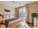 Stylishly staged bedroom with a large window and view to outside at 5201 Progresso St, Las Vegas, NV 89135