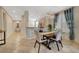 Elegant dining area features a wood table and a modern chandelier at 5201 Progresso St, Las Vegas, NV 89135