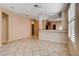 View of kitchen area with tile floors, bar, and modern chandelier at 5201 Progresso St, Las Vegas, NV 89135