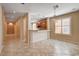 Well-lit kitchen view featuring tile floors, bar, and chandelier at 5201 Progresso St, Las Vegas, NV 89135