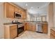 Updated kitchen featuring stainless steel appliances and granite countertops at 5201 Progresso St, Las Vegas, NV 89135
