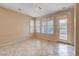 Open living space with tile flooring, ceiling fan, neutral paint and natural light at 5201 Progresso St, Las Vegas, NV 89135