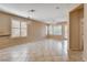 Open living space with tile flooring, ceiling fan, neutral paint and shuttered windows at 5201 Progresso St, Las Vegas, NV 89135
