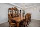 Elegant dining room featuring a large wooden table, chandelier, and ornate chairs at 537 Blanche Ct, Henderson, NV 89052