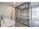 Luxurious bathroom with soaking tub and large walk-in shower at 5423 San Florentine Ave, Las Vegas, NV 89141