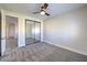Spacious bedroom with mirrored closet doors and gray carpeting at 5423 San Florentine Ave, Las Vegas, NV 89141