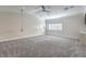 Spacious bonus room with vaulted ceiling, ceiling fan, and plush carpeting at 5423 San Florentine Ave, Las Vegas, NV 89141