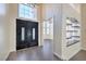 Elegant entryway with double doors, high ceilings, and built-in shelving at 5423 San Florentine Ave, Las Vegas, NV 89141