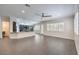 Open kitchen with large island, dark cabinetry, and granite countertops at 5423 San Florentine Ave, Las Vegas, NV 89141