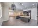 Modern kitchen with large island, granite countertops, and stainless steel appliances at 5423 San Florentine Ave, Las Vegas, NV 89141