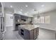 Gourmet kitchen features granite island and stainless steel appliances at 5423 San Florentine Ave, Las Vegas, NV 89141