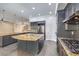 Spacious kitchen boasts granite island, custom cabinetry, and high-end appliances at 5423 San Florentine Ave, Las Vegas, NV 89141