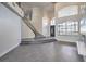 Open living area with high ceilings, a staircase, and tile floors at 5423 San Florentine Ave, Las Vegas, NV 89141