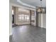Open living room with high ceilings and a view into the kitchen and entryway at 5423 San Florentine Ave, Las Vegas, NV 89141